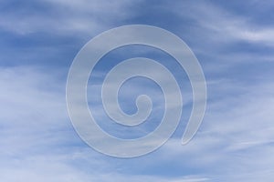Wispy, translucent clouds against a darkening blue sky just before sunset. Suitable for abstract forms can be used as backgrounds.