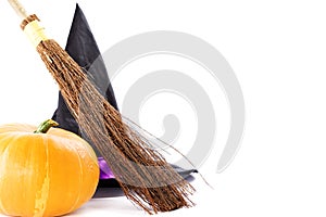 Witch broomstick, pumpkin and hat