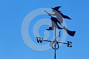 Witch on broomstick weather vane