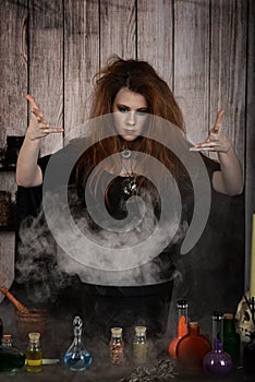 Witch casting a spell with smoke and cauldron