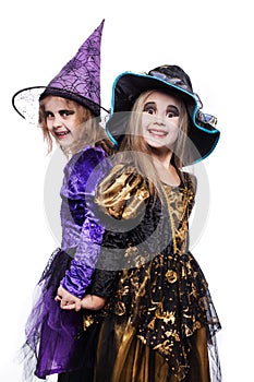 Witch children with trick or treat. Halloween. Fairy. Tale. Studio portrait isolated over white background