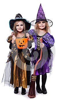 Witch children with trick or treat. Halloween. Fairy. Tale. Studio portrait isolated over white background