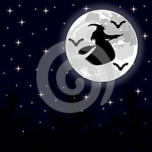 Witch flying on a broom on a full moon in the forest