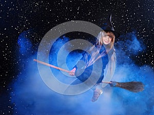 Witch flying on broomstick.