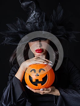 Witch with Halloween pumpkin