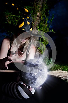 Witch with magic sphere