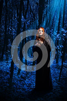 Witch at night forest