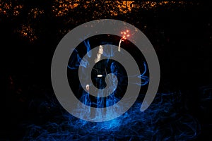 Witch playing with lights red and blue