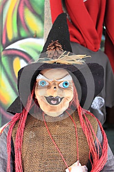 Witch puppet with a malicious smile