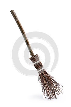 Witch`s magic broom isolated on white background photo