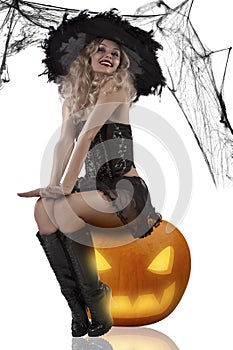 witch sitting on a pumpkin