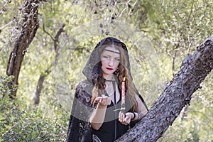 Witch women during Halloween in the forest