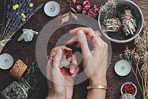 Witches hands on a table ready for spell work