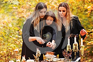 Witches preparing witch potion on Halloween day