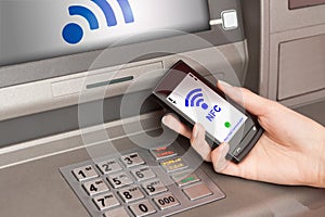 Withdrawing money atm with mobile phone a NFC terminal