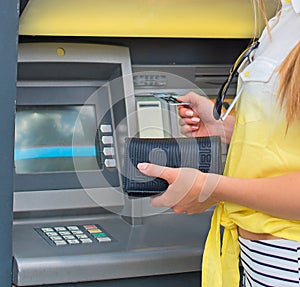 Withdrawing money from an ATM. photo