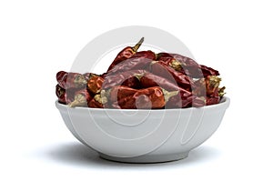 Withe bowl with red chili peppers