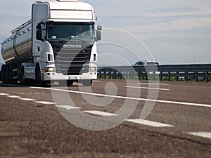 White Scania truck on highway