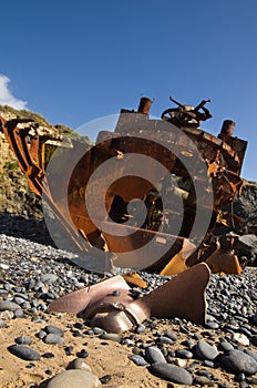 Withered and half buried propeller of a wrecked pusher boat