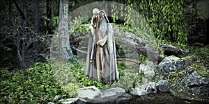 The Wizard of the woods. A legendary white cloaked wizard posing in his mythical enchanted forest by a nearby pond.