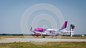 Wizz air airbus 320 is landing in Kharkiv intenational airport.