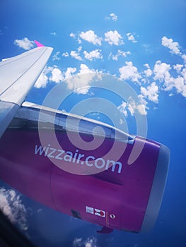 Wizzair plane wing and engine during flight