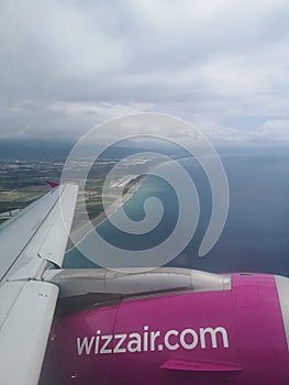 Wizzair plane wing and engine during flight