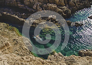 Wo persons swimming and snorkeling in the crystal clear turquoise water in Korakonissi, Zakynthos