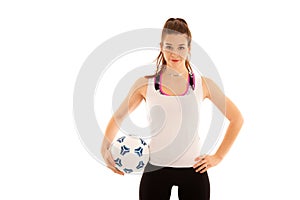 Woamn soccer player holds a ball isolated over white background