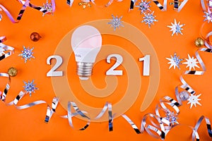 Wodden 2021 Creativity and inspiration ideas concepts with lightbulb on pastel color background.Business solution. Christmas