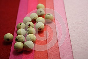 Woden beads on a red felt background