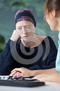 Woeful woman suffering from cancer