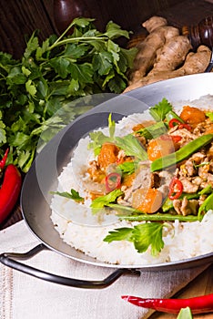 Wok pan with meat strips and vegetables