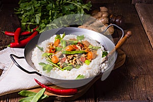 Wok pan with meat strips and vegetables photo