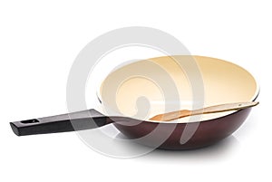 Wok with wooden spatula isolated on white background