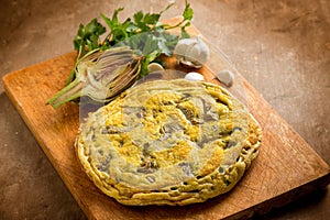 Wole omelet with artichoke with parsley photo