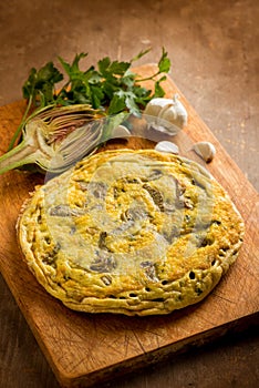 wole omelet with artichoke with parsley photo