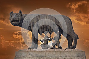 She wolf roman empire symbol breast feeding newborn romolus and remus statue on red sunset background