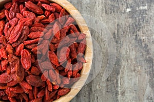 Wolfberries or Goji berries in bowl on wooden table