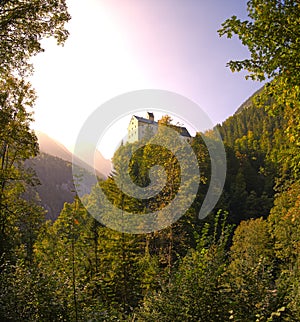 Wolfsklamm gorge in Austria the St. Georgenberg monastery on a hill on a rock in autumn