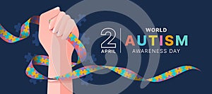 Wolrd Autism Awareness Day - Hand hold line autism awareness puzzle ribbon sign on dark blue and puzzle texture background vector photo