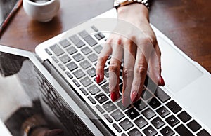 woma hand on a laptop keyboard, female hand on laptop , human hand, gadget