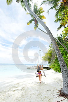 Womain in beach hammock