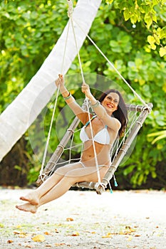 Womain in beach hammock