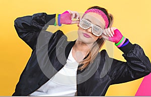 Woman in 1980`s fashion with shatter shade glasses