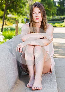 Woman 24-35 years old is feeling distressed and lonely alone