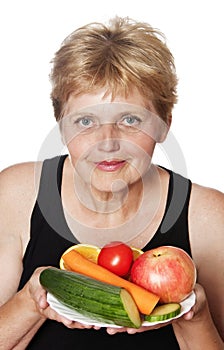 Woman (67 years old) with fruits