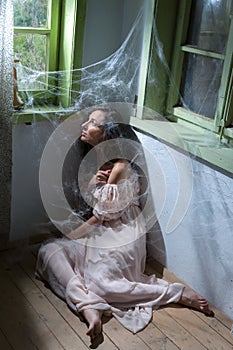 Woman in abandoned room