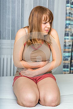 Woman with abdominal pain, stomach or menstrual cramps