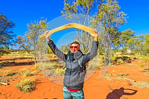Woman with aboriginal boomerang